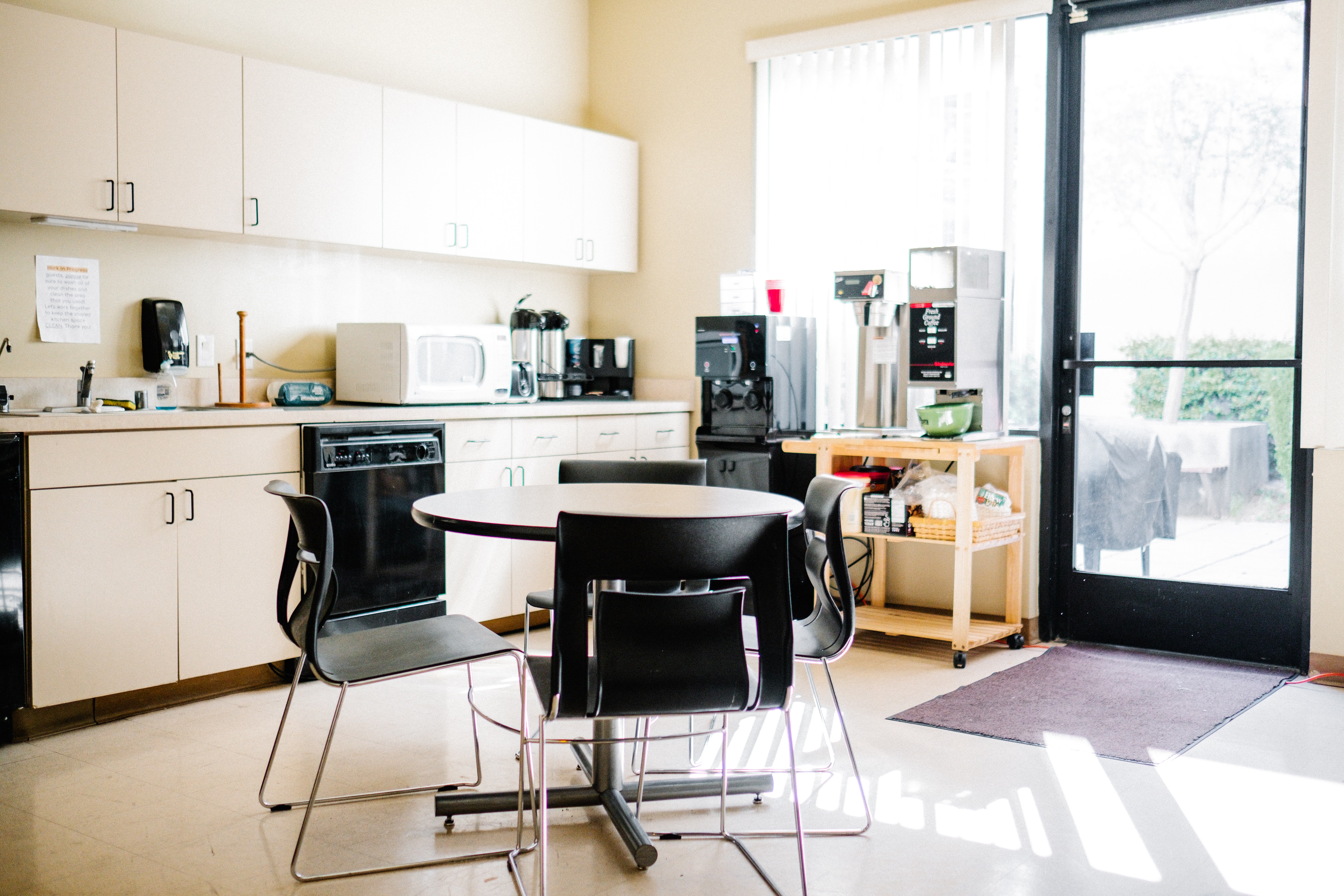 black and white wooden table and chairs